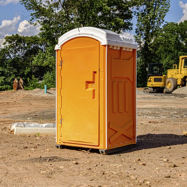 what is the cost difference between standard and deluxe portable restroom rentals in Belford